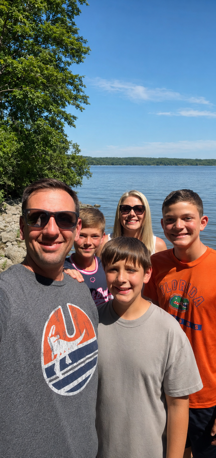 The Arnold family, owners of HogTown Hauling, together by the lake